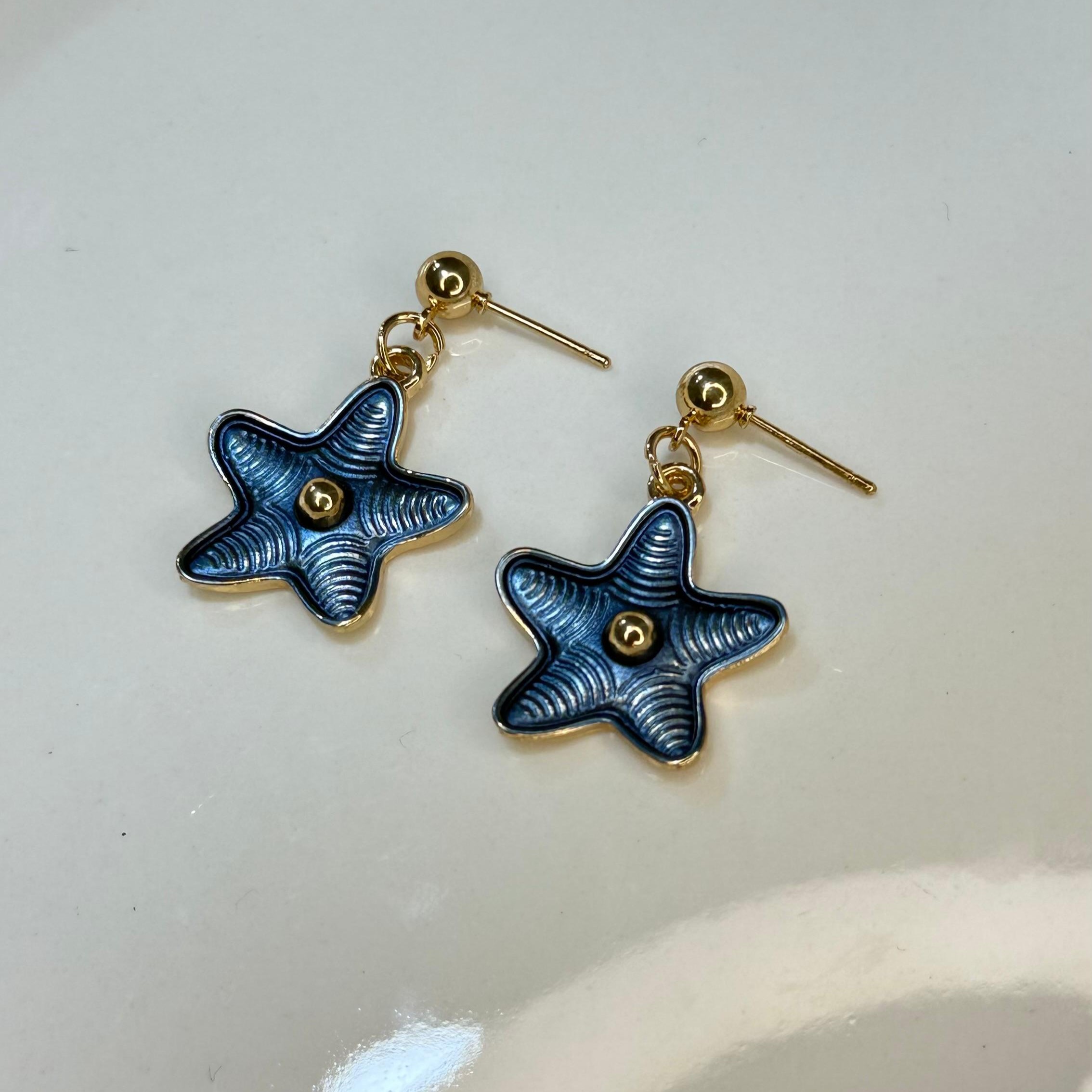 ARETES ESTRELLAS AZULES DA122508